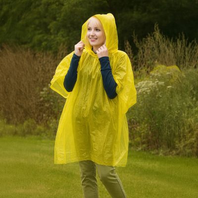Woman wearing a yellow fine and dandy disposivble rain coat